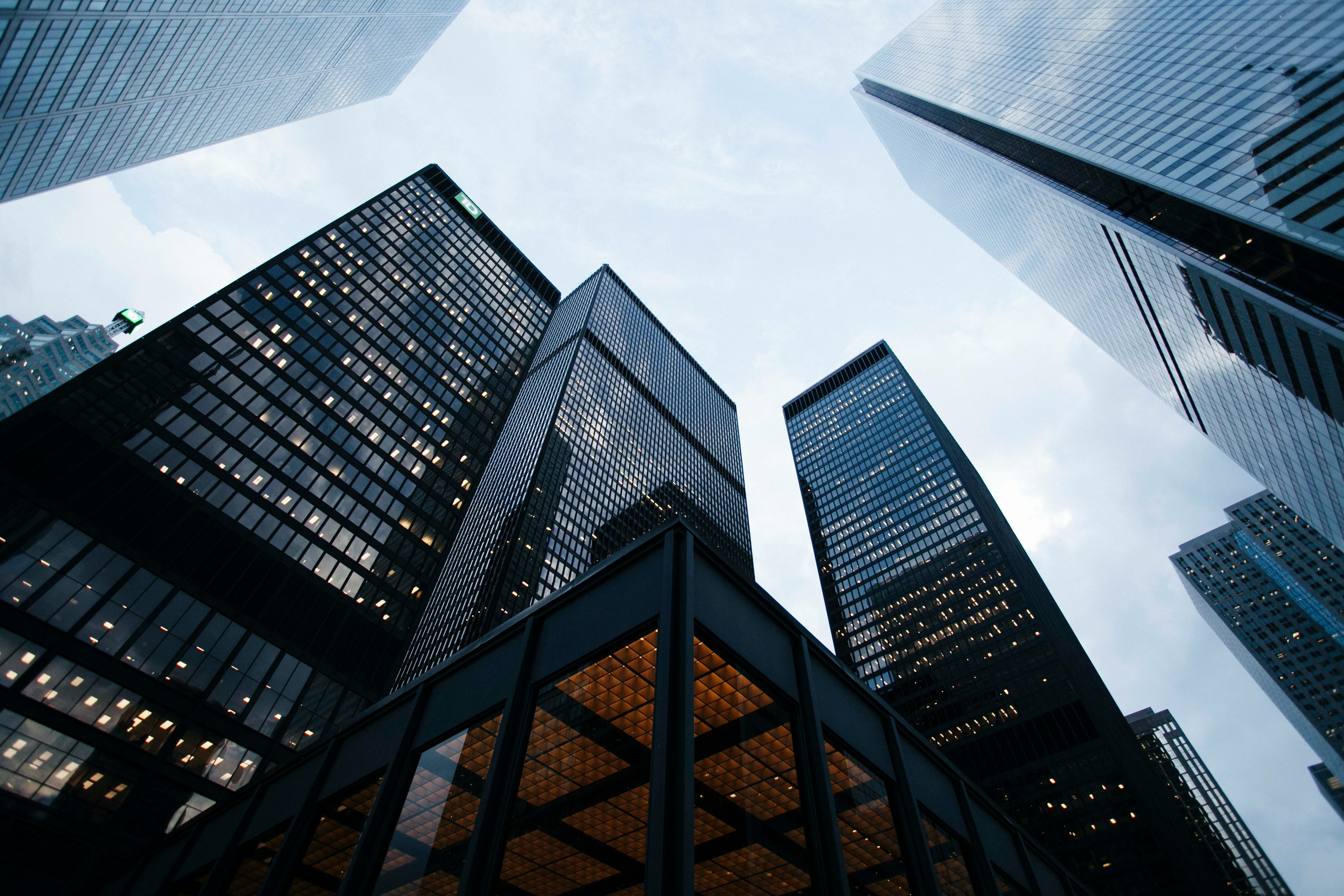 Low-angle view of glass-clad skyscrapers symbolizing secure corporate communication