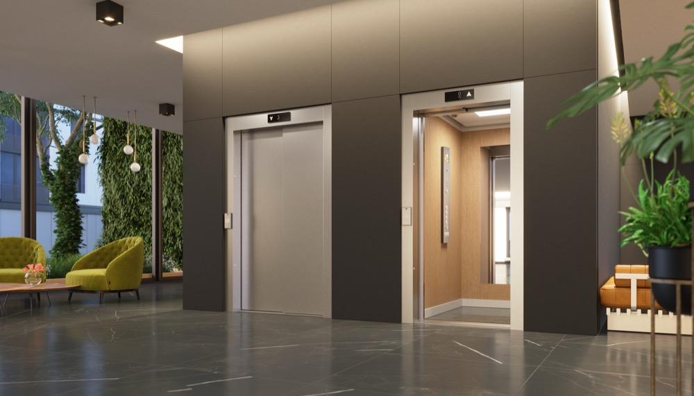 Modern lobby with two stainless steel elevators, one closed and one open showing a wood-paneled interior