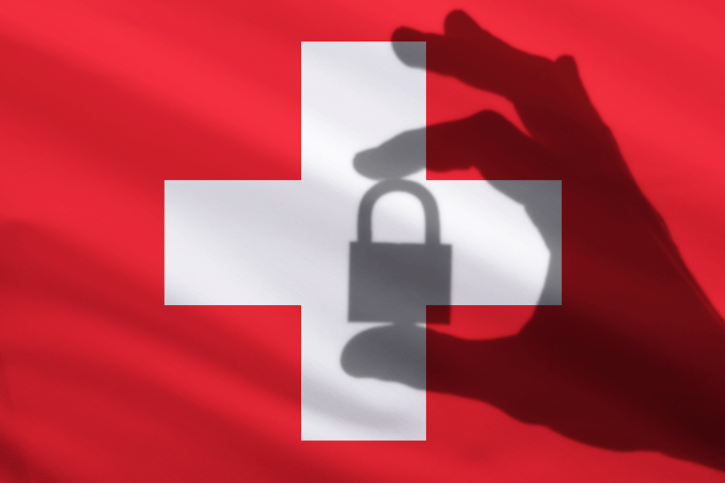 Swiss flag covered by a shadow in the shape of a hand holding a lock.