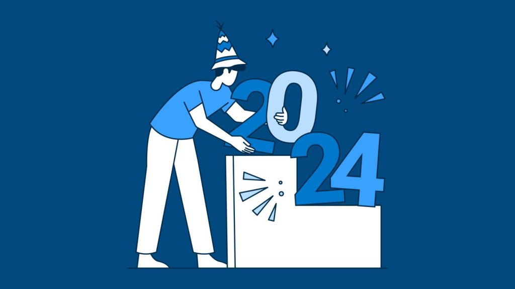 Person in party hat arranging large '2024' numbers on white platform with confetti on blue background.